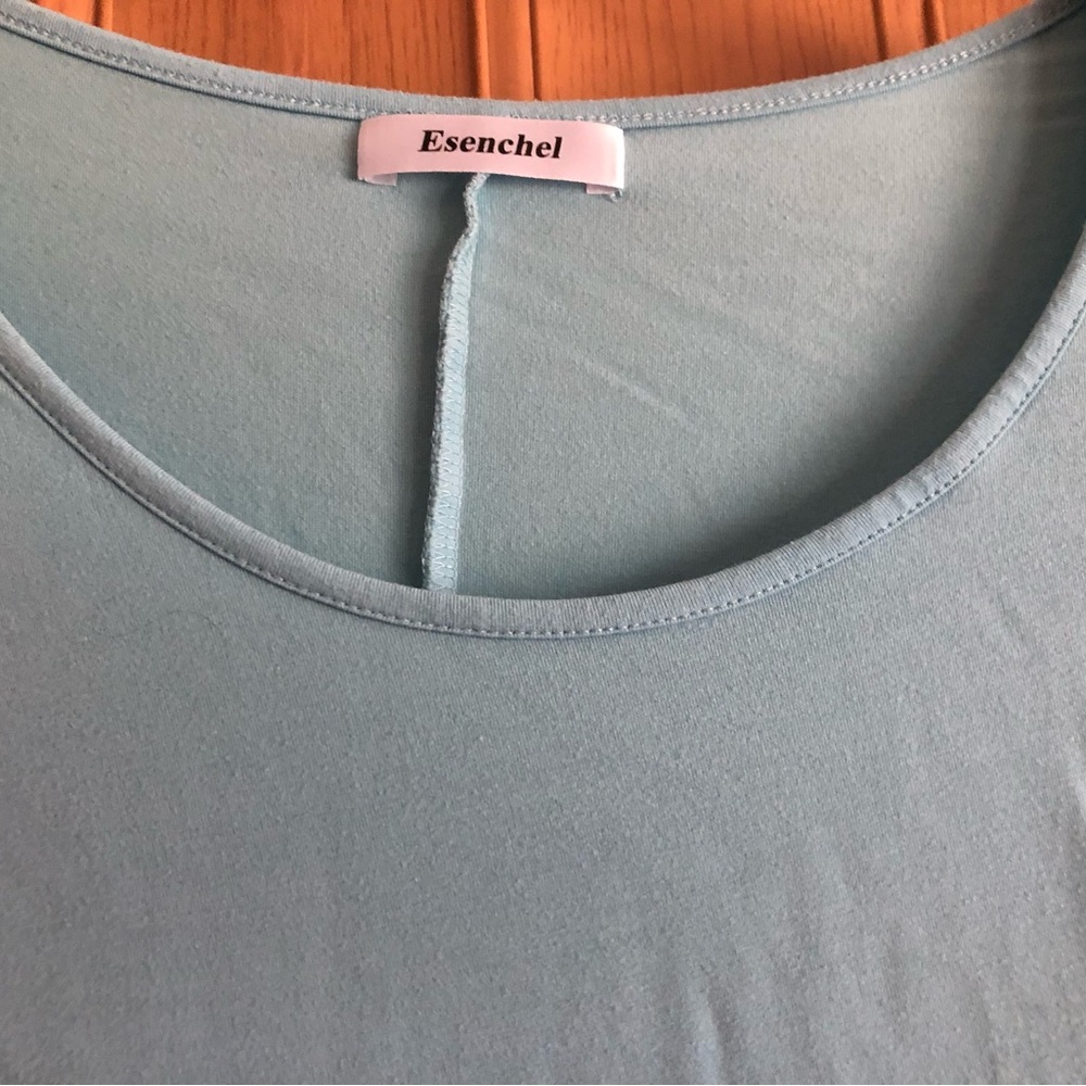 Nice and versatile! Esenchel light blue sz 4x flowy top. Excellent with leggings